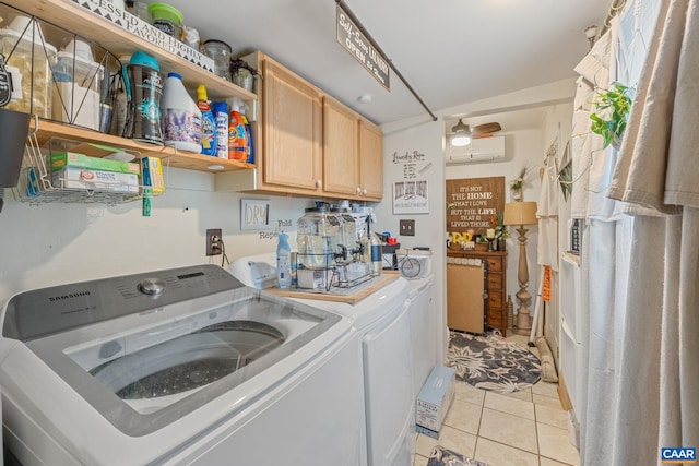 325 10 1/2 St NW, Charlottesville, VA 22903 - clothes washing area featuring washer and dryer, light tile patterned floors, a wall unit AC, and cabinet space