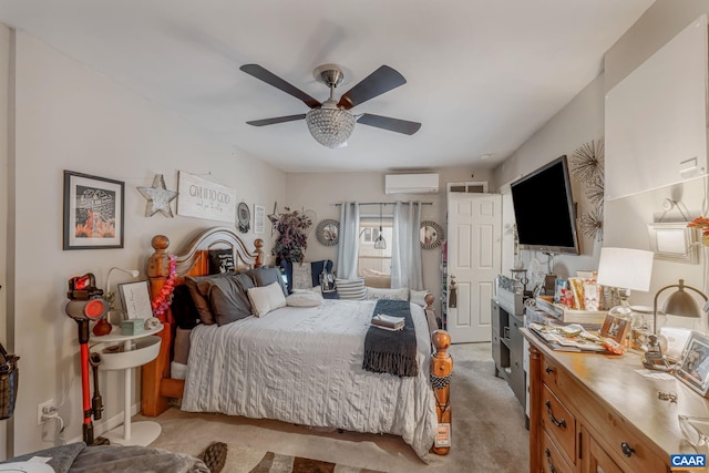 bedroom with a ceiling fan, a wall unit AC, and light colored carpet