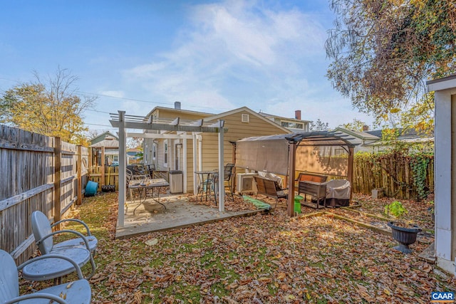 325 10 1/2 St NW, Charlottesville, VA 22903 - back of house with a pergola, a patio, a fenced backyard, and outdoor lounge area