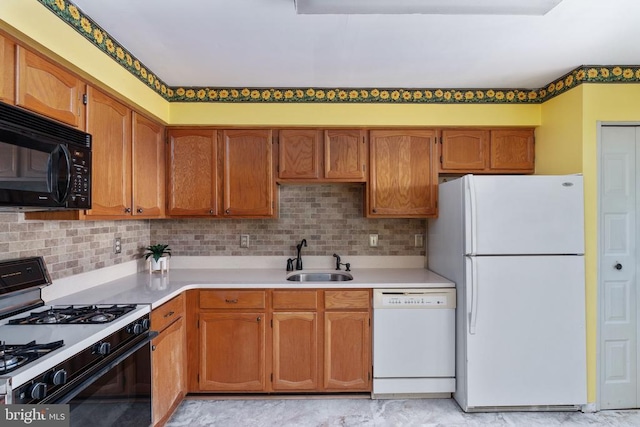 10718 Brice Ct, Fredericksburg, VA 22407 - kitchen featuring white appliances, a sink, brown cabinetry, light countertops, and tasteful backsplash