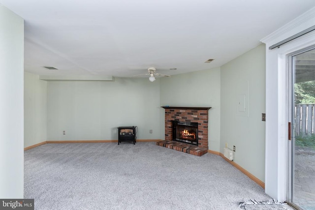 10718 Brice Ct, Fredericksburg, VA 22407 - unfurnished living room with ceiling fan, carpet floors, baseboards, and a brick fireplace