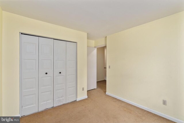 10718 Brice Ct, Fredericksburg, VA 22407 - unfurnished bedroom featuring light carpet, baseboards, and a closet