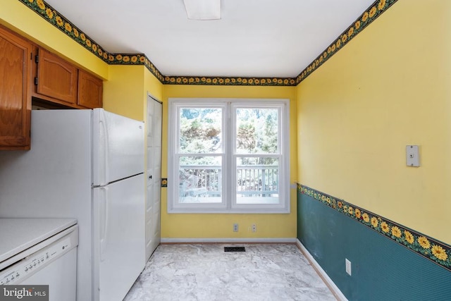 10718 Brice Ct, Fredericksburg, VA 22407 - kitchen featuring white appliances, baseboards, and brown cabinetry