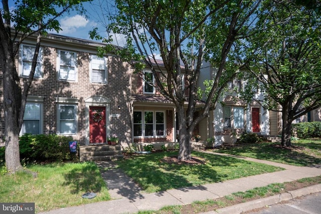 10718 Brice Ct, Fredericksburg, VA 22407 - view of front facade featuring brick siding and a front yard