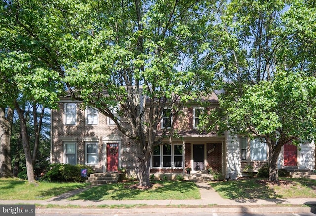 10718 Brice Ct, Fredericksburg, VA 22407 - obstructed view of property with brick siding and a front yard