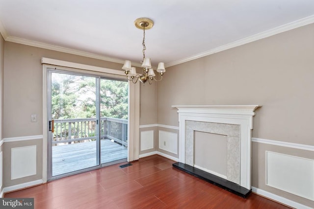 10718 Brice Ct, Fredericksburg, VA 22407 - unfurnished living room featuring a chandelier, dark wood-type flooring, and ornamental molding