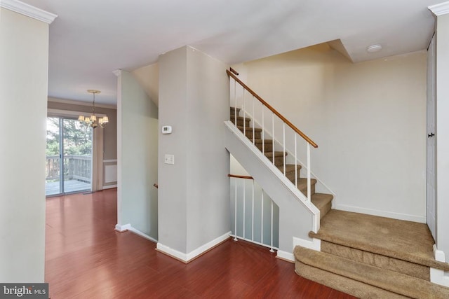 10718 Brice Ct, Fredericksburg, VA 22407 - staircase with wood finished floors, a chandelier, and baseboards