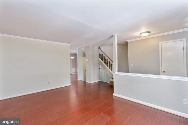 10718 Brice Ct, Fredericksburg, VA 22407 - spare room with stairway, wood finished floors, baseboards, crown molding, and a chandelier