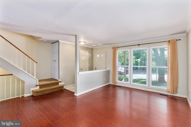 10718 Brice Ct, Fredericksburg, VA 22407 - unfurnished living room with wood finished floors, crown molding, stairs, and baseboards
