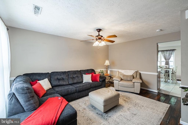 9910 Warwick Pl, Fredericksburg, VA 22408 - living area with wood-type flooring, ceiling fan, a textured ceiling, and baseboards