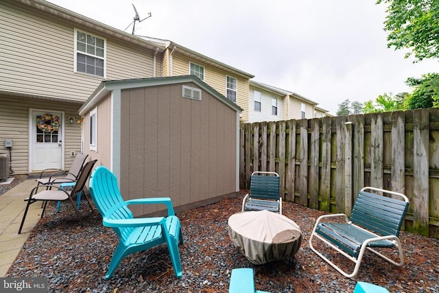 9910 Warwick Pl, Fredericksburg, VA 22408 - fenced backyard with central AC unit and a patio area