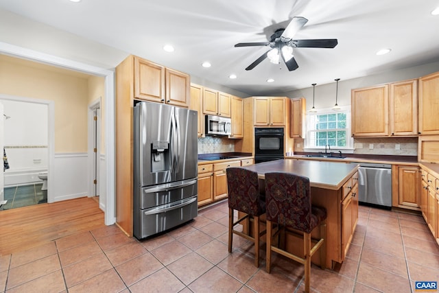 1972 Sclaters Ford Rd, Palmyra, VA 22963 - kitchen featuring black appliances, light brown cabinets, a sink, tasteful backsplash, and recessed lighting