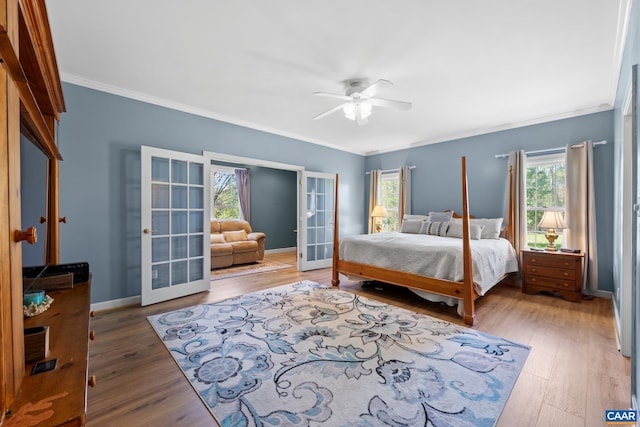 1972 Sclaters Ford Rd, Palmyra, VA 22963 - bedroom with french doors, ornamental molding, wood finished floors, baseboards, and a ceiling fan
