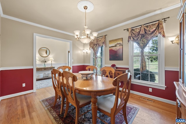 1972 Sclaters Ford Rd, Palmyra, VA 22963 - dining room with a chandelier, light wood-style floors, ornamental molding, and baseboards