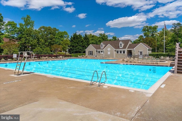 9814 Dominion Forest Cir, Fredericksburg, VA 22408 - community pool with view of scattered trees, fence, and a patio