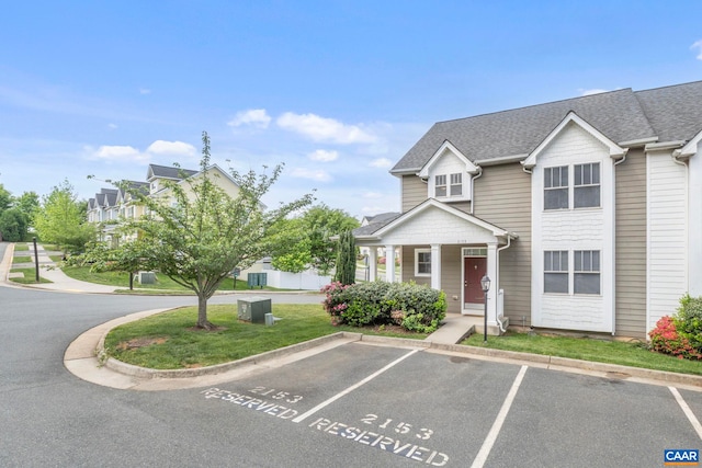 2153 Saranac Ct, Charlottesville, VA 22911 - view of front facade featuring a shingled roof, covered porch, and uncovered parking