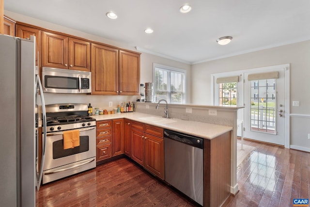 2153 Saranac Ct, Charlottesville, VA 22911 - kitchen with a sink, brown cabinets, crown molding, light countertops, and appliances with stainless steel finishes