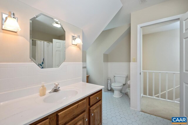 168 Lakeland Ln, Faber, VA 22938 - bathroom with vanity, wainscoting, tile walls, and tile patterned floors