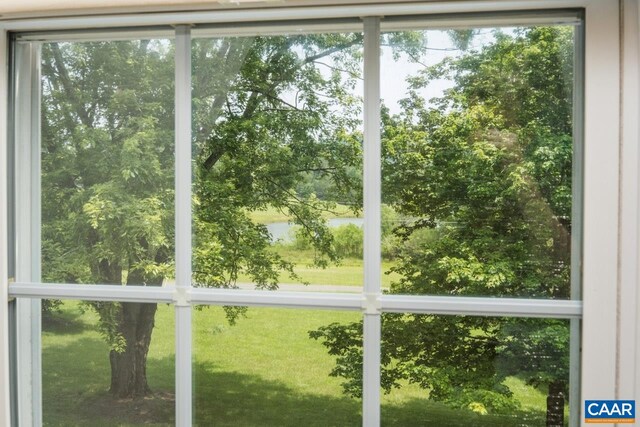 168 Lakeland Ln, Faber, VA 22938 - unfurnished sunroom featuring a water view and view of wooded area