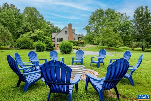 168 Lakeland Ln, Faber, VA 22938 - view of grassy yard with an outdoor fire pit