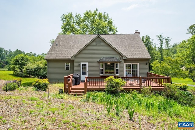 168 Lakeland Ln, Faber, VA 22938 - rear view of house featuring a deck, a shingled roof, and a chimney