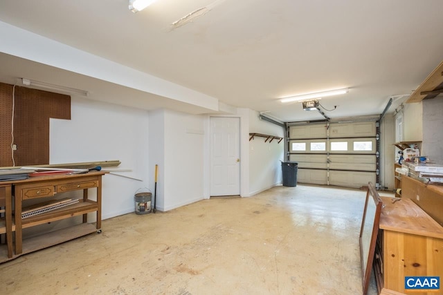 168 Lakeland Ln, Faber, VA 22938 - garage featuring a garage door opener and baseboards