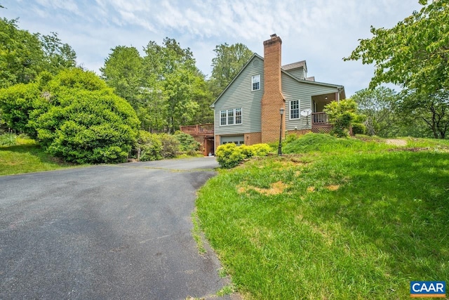 168 Lakeland Ln, Faber, VA 22938 - view of side of property featuring a chimney, driveway, and a garage