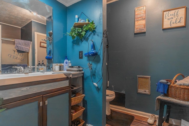 9274 Spotswood Trl, Mcgaheysville, VA 22840 - bathroom featuring vanity, toilet, ornamental molding, and wood finished floors