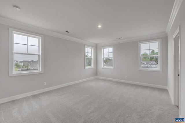 unfurnished room featuring visible vents, baseboards, light colored carpet, ornamental molding, and recessed lighting