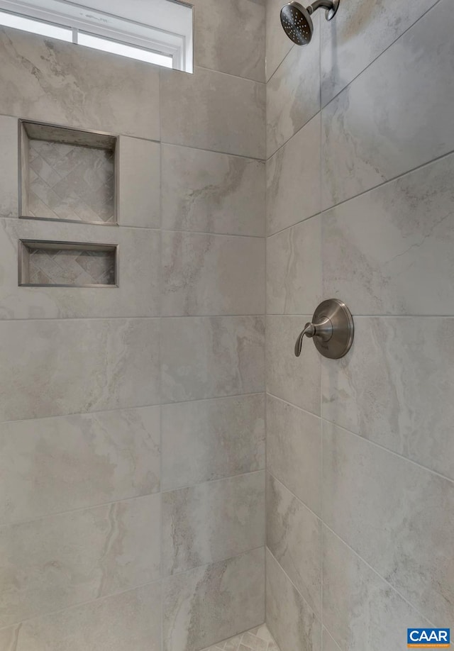 details with a tile shower