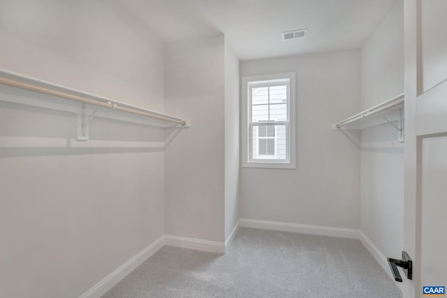 walk in closet with carpet flooring and visible vents