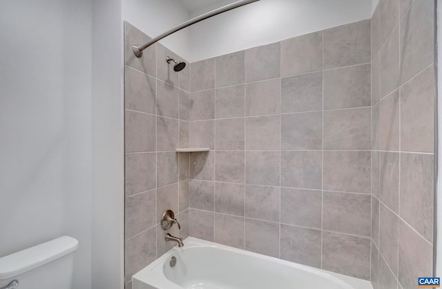 full bathroom featuring toilet and shower / washtub combination