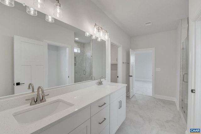 full bathroom with a stall shower, visible vents, double vanity, and a sink