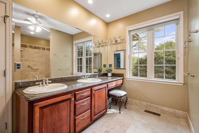 1763 Red Top Orchard Rd, Waynesboro, VA 22980 - full bathroom with double vanity, baseboards, a tile shower, and ceiling fan
