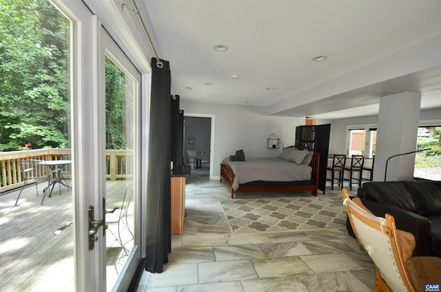 bedroom with multiple windows and recessed lighting