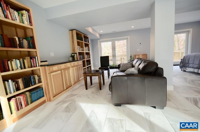 living area with recessed lighting and plenty of natural light