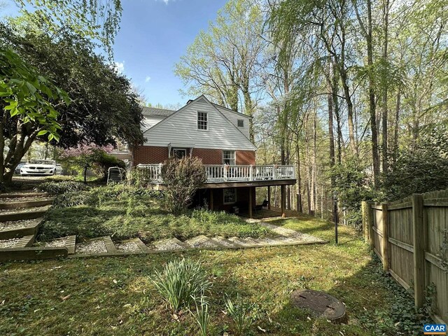 1895 Westview Rd, Charlottesville, VA 22903 - back of property with a deck, fence, and brick siding