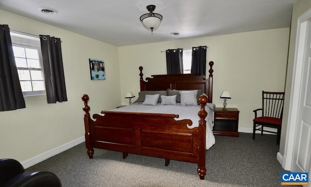 carpeted bedroom with baseboards and visible vents