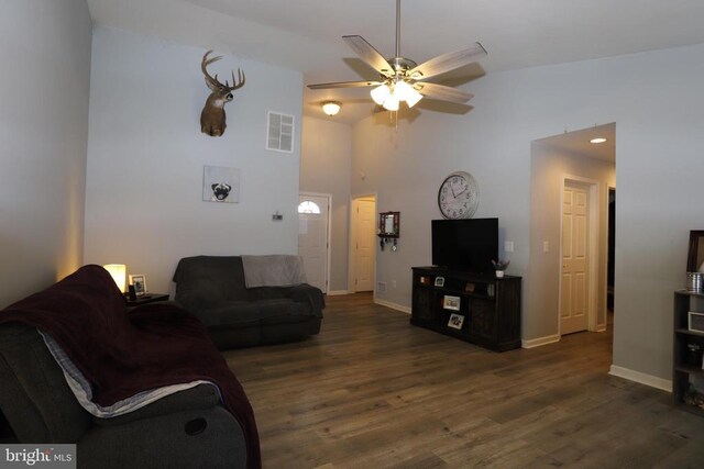 living room featuring high vaulted ceiling, dark hardwood / wood-style floors, and ceiling fan