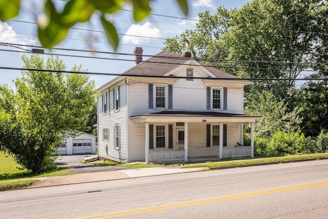 1221 Keezletown Rd, Weyers Cave, VA 24486 - view of front of house with a porch, a garage, a chimney, and an outbuilding