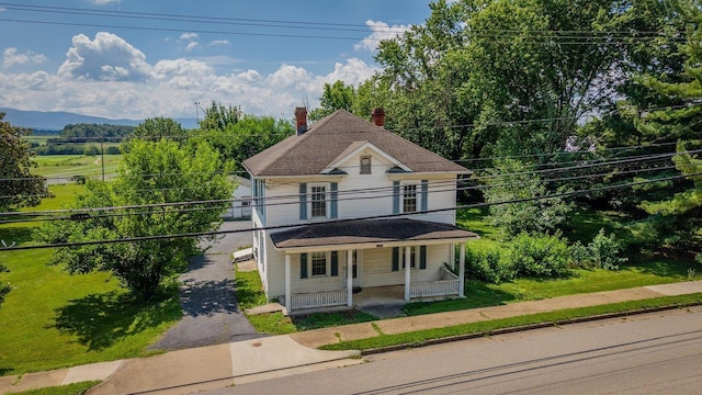 1221 Keezletown Rd, Weyers Cave, VA 24486 - view of front of home featuring a porch, a balcony, and a chimney