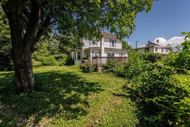 1221 Keezletown Rd, Weyers Cave, VA 24486 - view of green lawn featuring a wooden deck