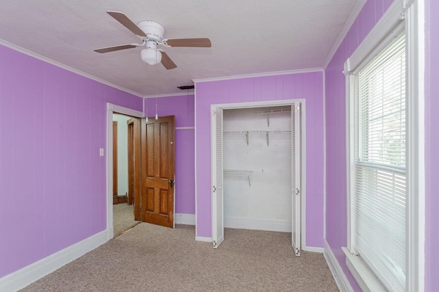 1221 Keezletown Rd, Weyers Cave, VA 24486 - unfurnished bedroom featuring crown molding, a closet, carpet floors, ceiling fan, and a textured ceiling