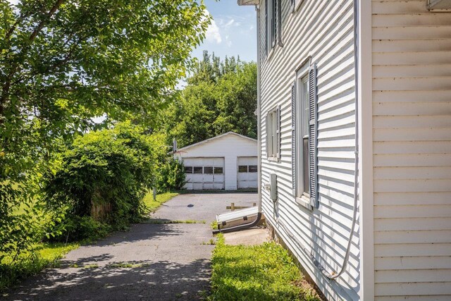 1221 Keezletown Rd, Weyers Cave, VA 24486 - view of side of home with a detached garage and an outbuilding