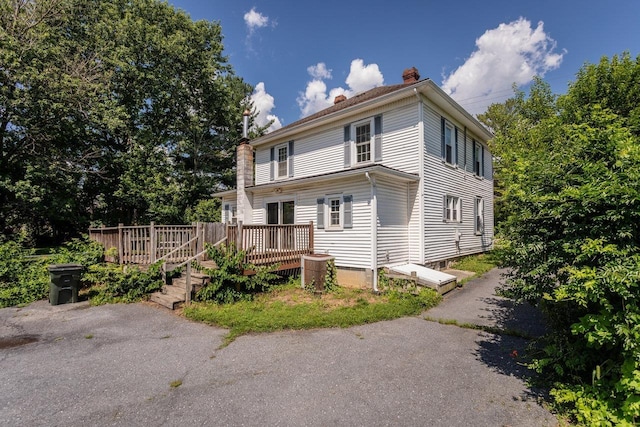 1221 Keezletown Rd, Weyers Cave, VA 24486 - view of front facade with a deck and a chimney