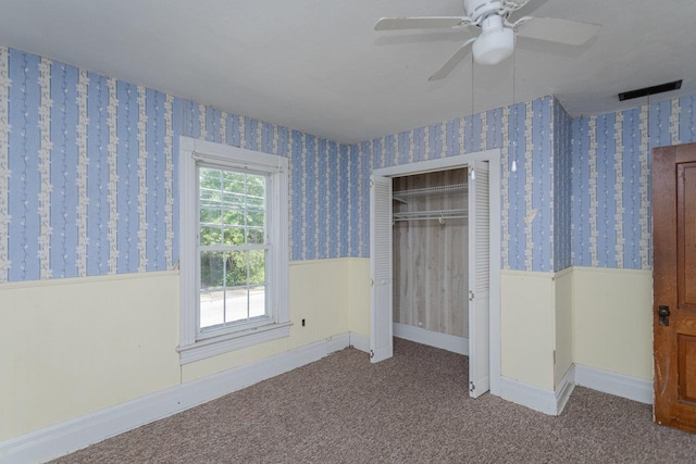 1221 Keezletown Rd, Weyers Cave, VA 24486 - unfurnished bedroom featuring wainscoting, carpet floors, a closet, wallpapered walls, and ceiling fan