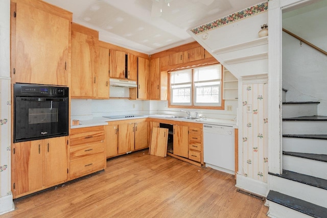 1221 Keezletown Rd, Weyers Cave, VA 24486 - kitchen with black appliances, under cabinet range hood, light countertops, and light wood-type flooring