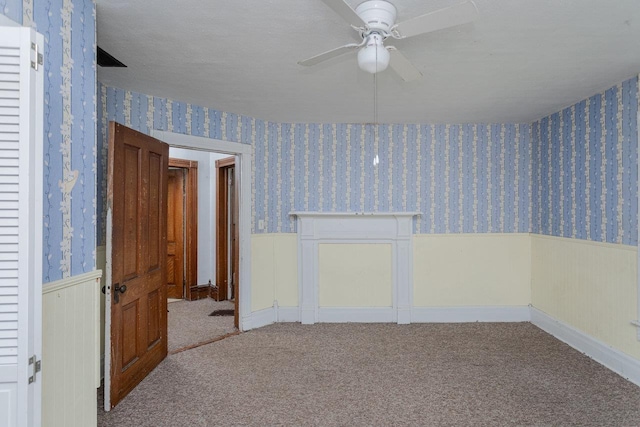 1221 Keezletown Rd, Weyers Cave, VA 24486 - carpeted spare room featuring wainscoting, wallpapered walls, and a ceiling fan
