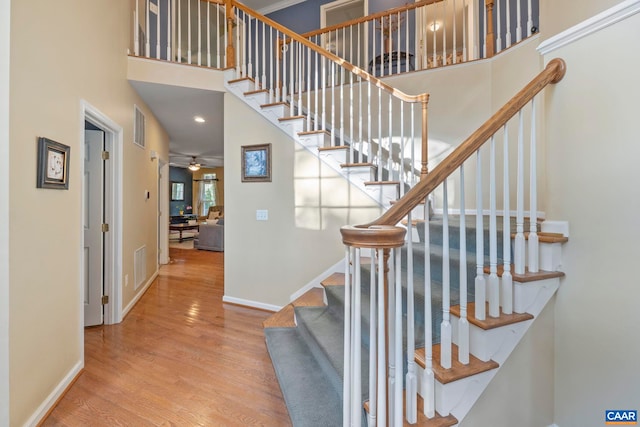 797 Willow Ridge Rd, Troy, VA 22974 - staircase featuring wood finished floors, a high ceiling, and ceiling fan