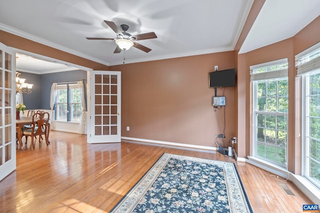 797 Willow Ridge Rd, Troy, VA 22974 - empty room featuring wood finished floors, a chandelier, a ceiling fan, french doors, and ornamental molding